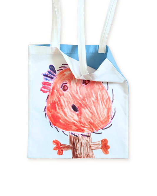 tote bag con il disegno di un bambino impresso sul fronte e un tessuto monocromo azzurro sul retro. 100% in cotone